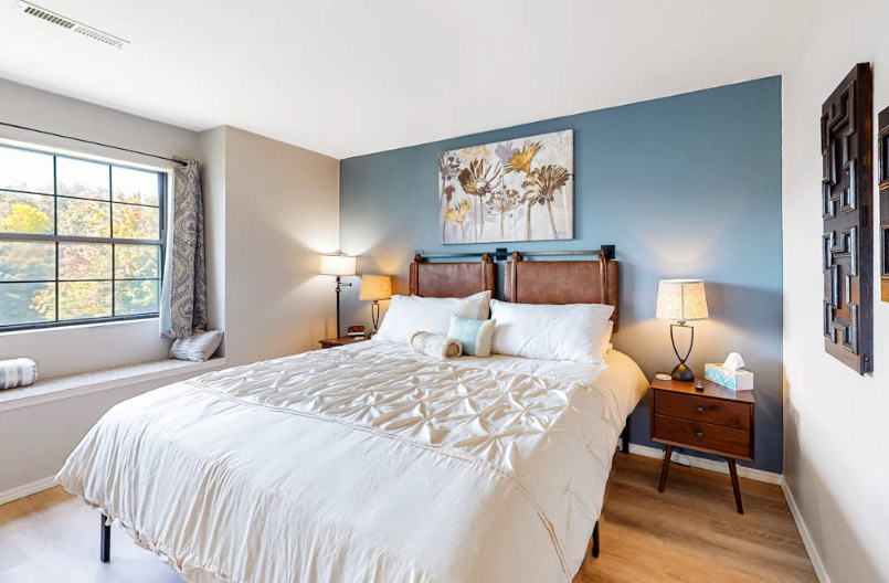 Stylish vacation rental bedroom with blue accent wall